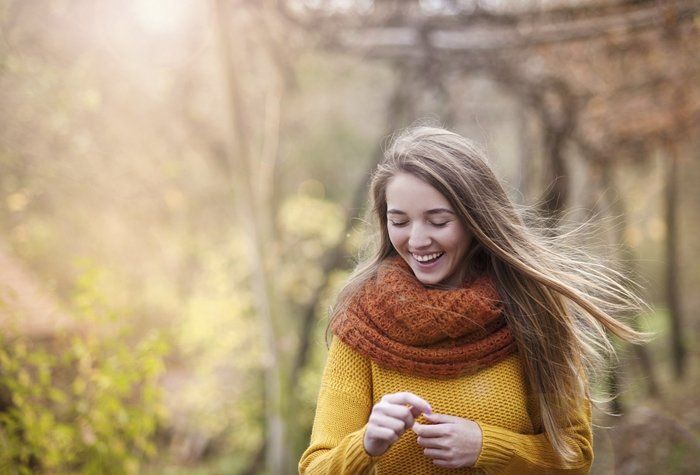 Outdoor portrait of beautiful girl in autumn forest